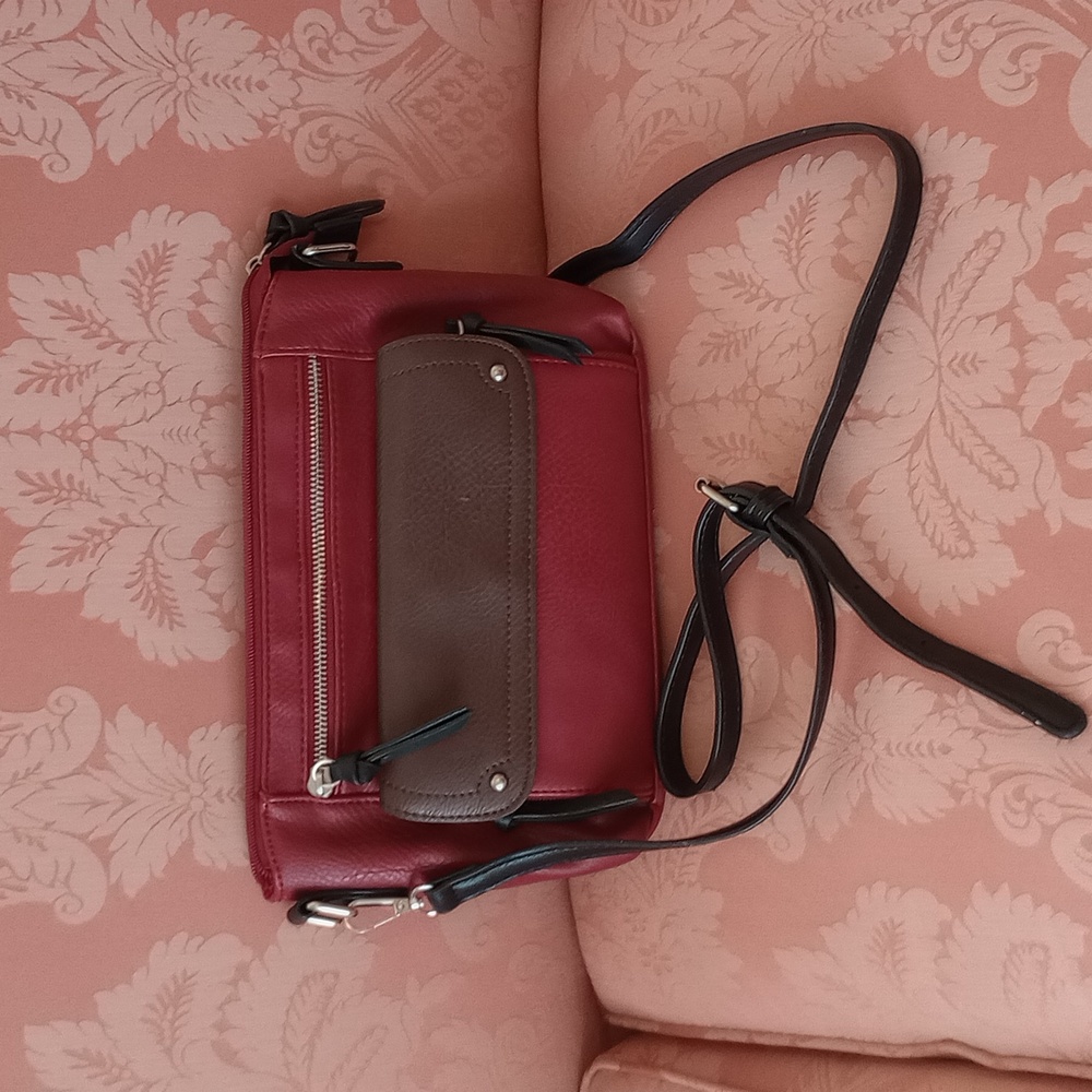 VGUC. Bueno burgundy crossbody bag with black and brown trim.